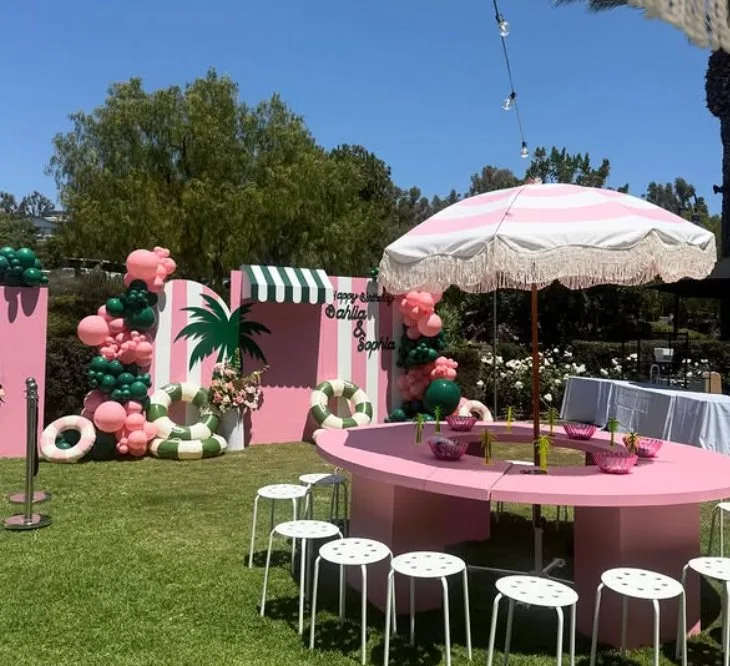 Bounce House City party setup with balloon garland at a Santa Ana backyard event