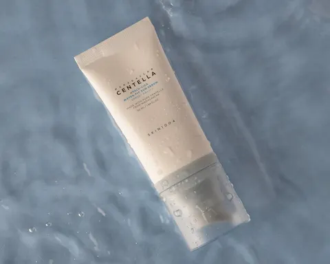 Centella sunscreen tube floating on rippling water, product shoot for a small beauty store in Koreatown, Los Angeles, CA