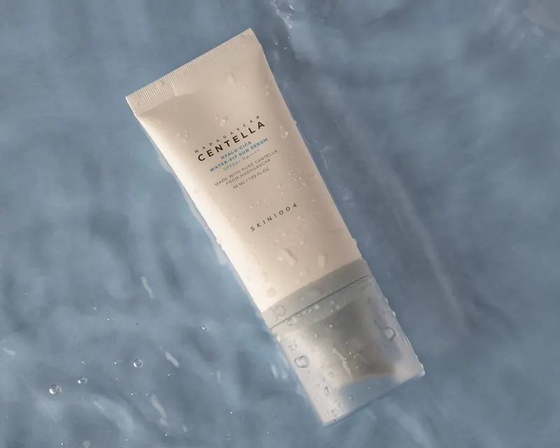 Centella sunscreen tube floating on rippling water, product shoot for a small beauty store in Koreatown, Los Angeles, CA