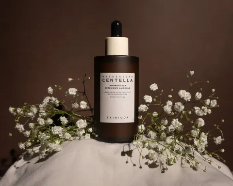 Centella skincare serum bottle styled with baby’s breath flowers, product shoot for a small beauty store in Koreatown, Los Angeles, CA
