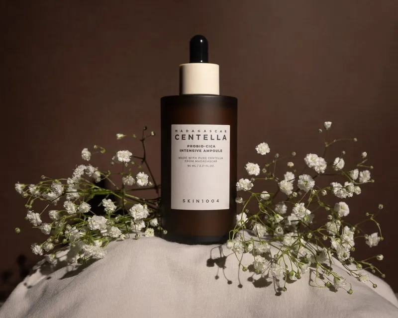 Centella skincare serum bottle styled with baby’s breath flowers, product shoot for a small beauty store in Koreatown, Los Angeles, CA